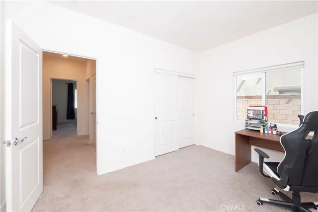 a bathroom with a toilet a sink and a window