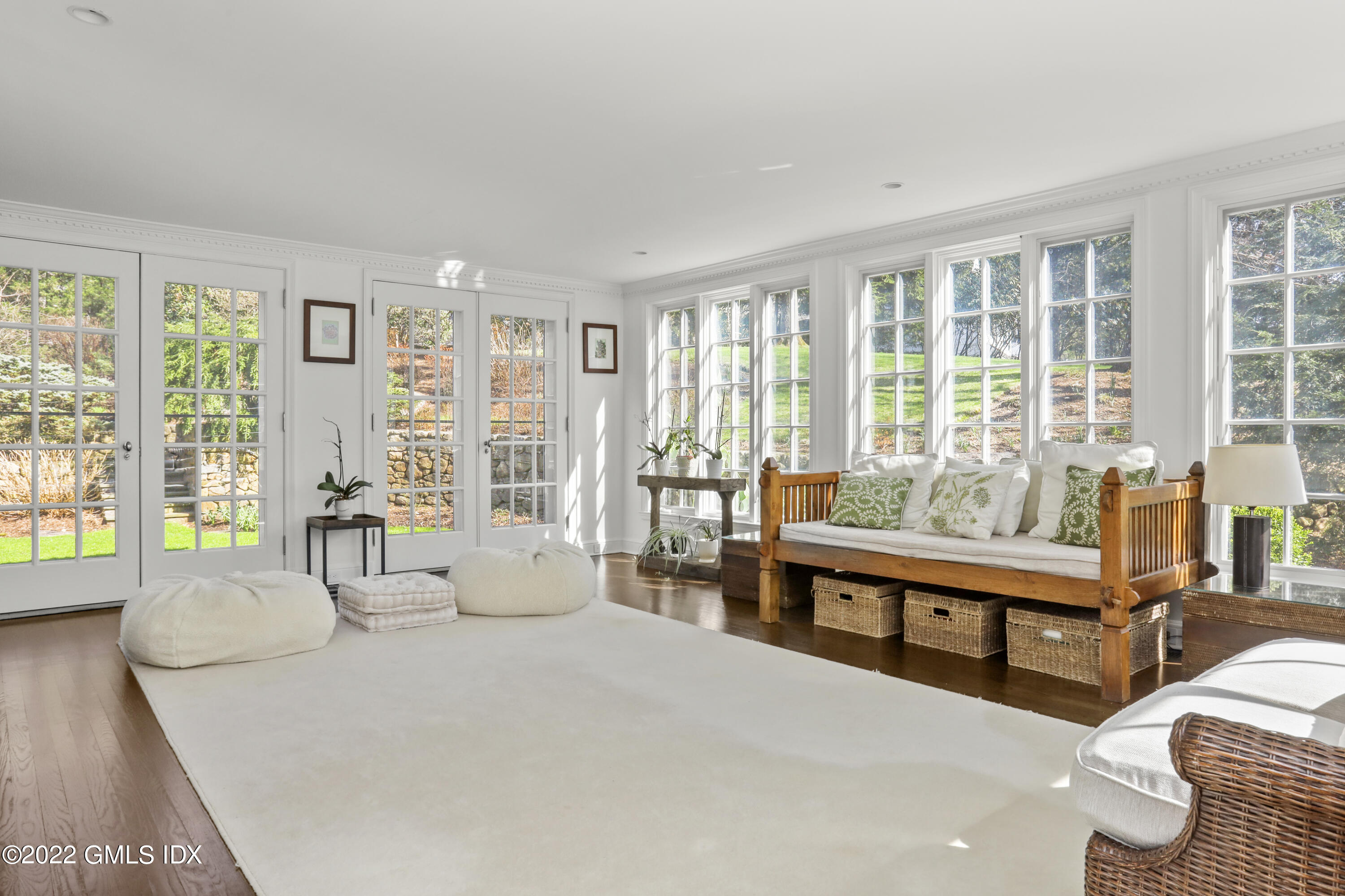 99 Husted Lane Greenwich, CT 06830 - Photo 12 of 27 a living room with furniture and large windows