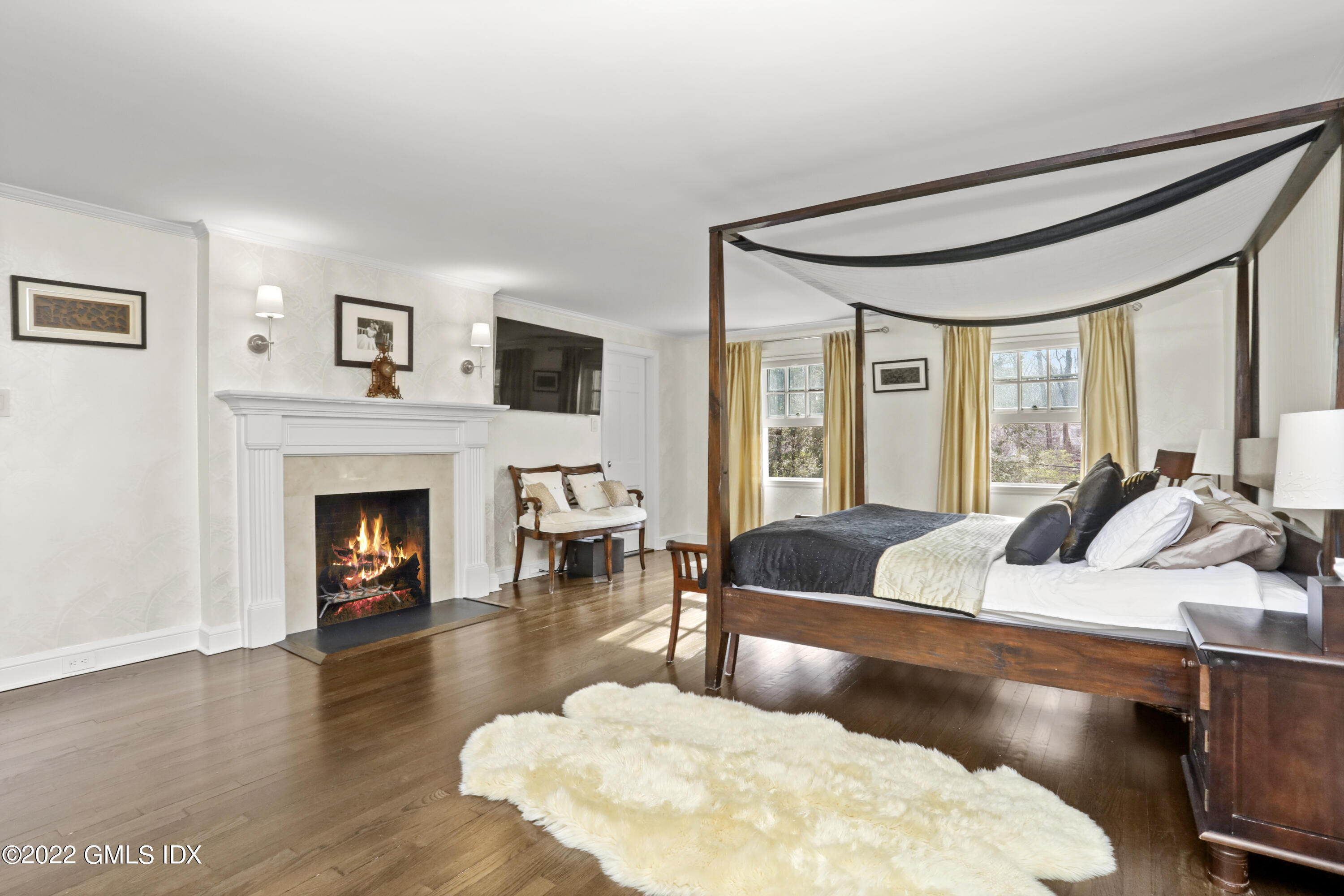 99 Husted Lane Greenwich, CT 06830 - Photo 13 of 27 a living room with furniture and a fireplace