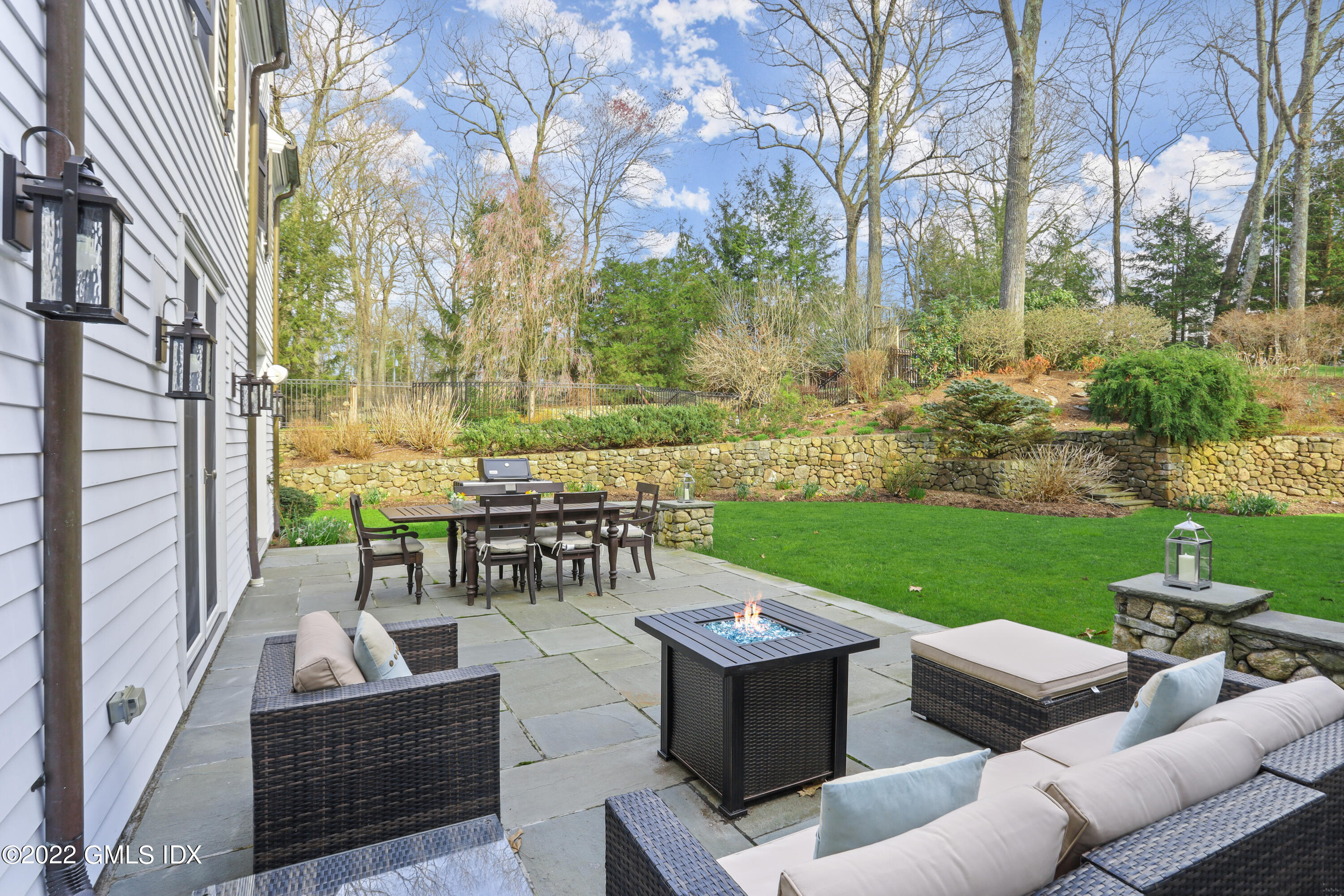 99 Husted Lane Greenwich, CT 06830 - Photo 22 of 27 a view of a couches in a patio with a yard