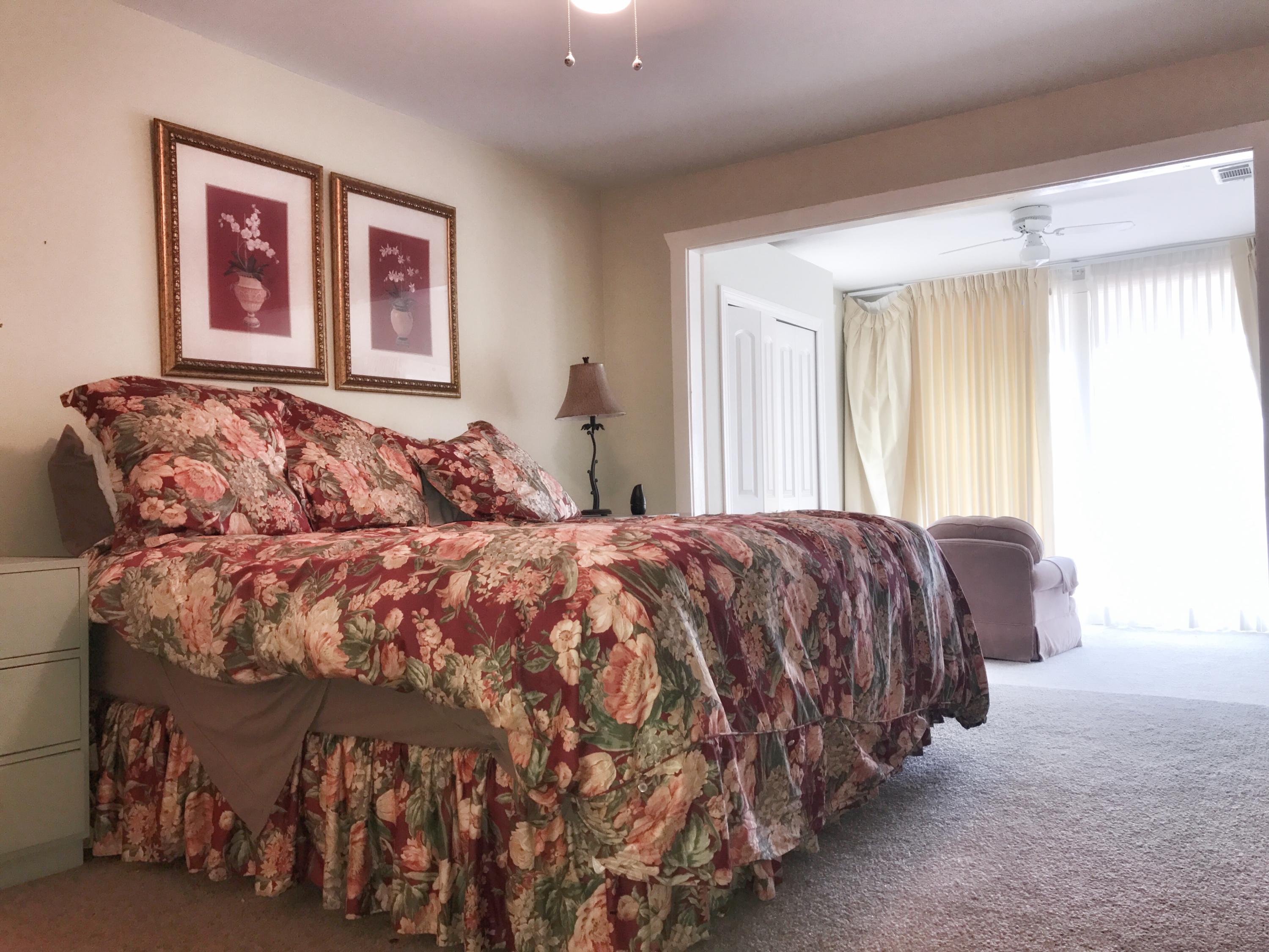 1326 Spring Lake Road DeFuniak Springs, FL 32433 - Photo 11 of 25 a bedroom with a bed and a painting on the wall