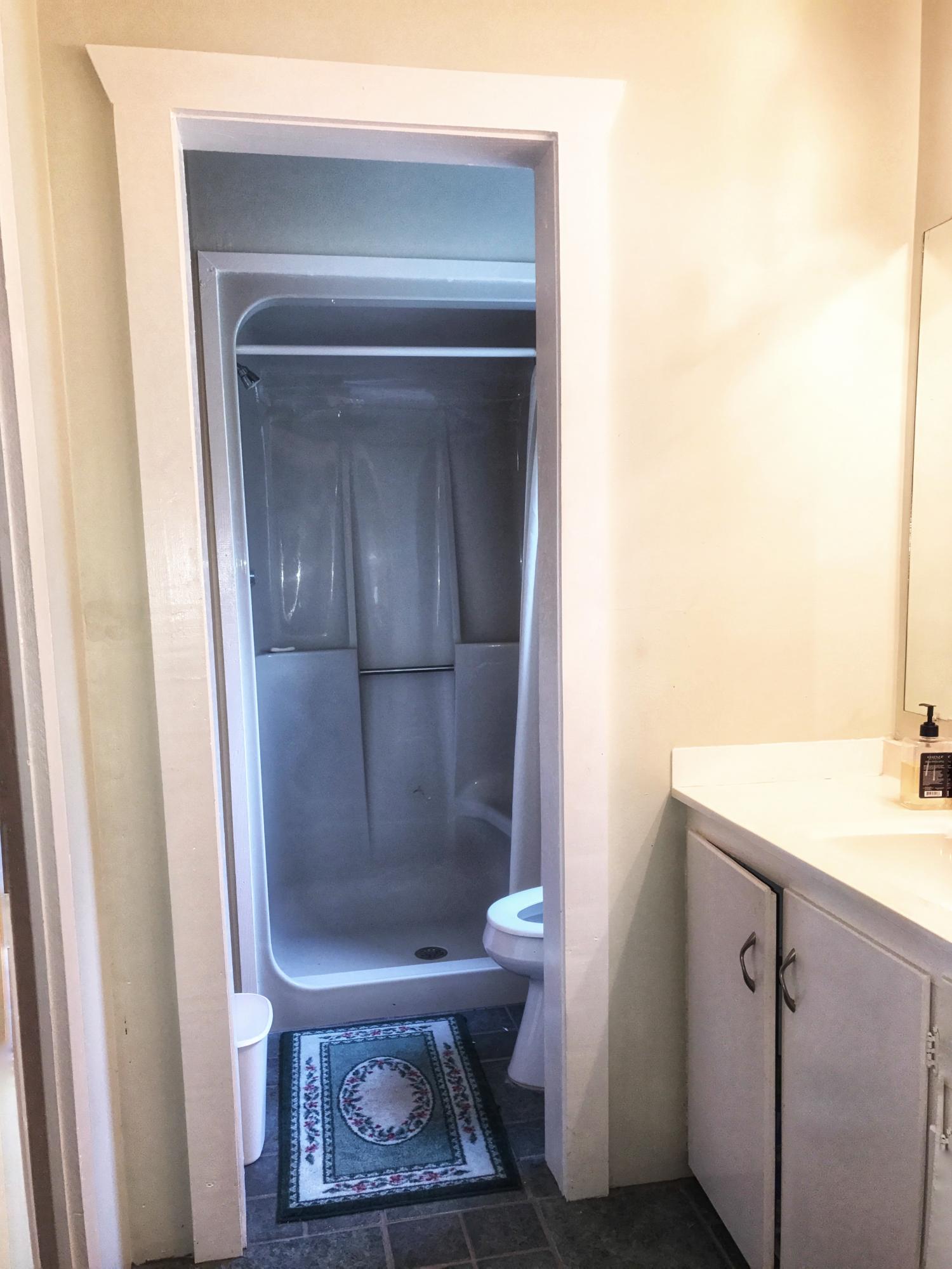 1326 Spring Lake Road DeFuniak Springs, FL 32433 - Photo 13 of 25 a bathroom with a sink toilet and shower