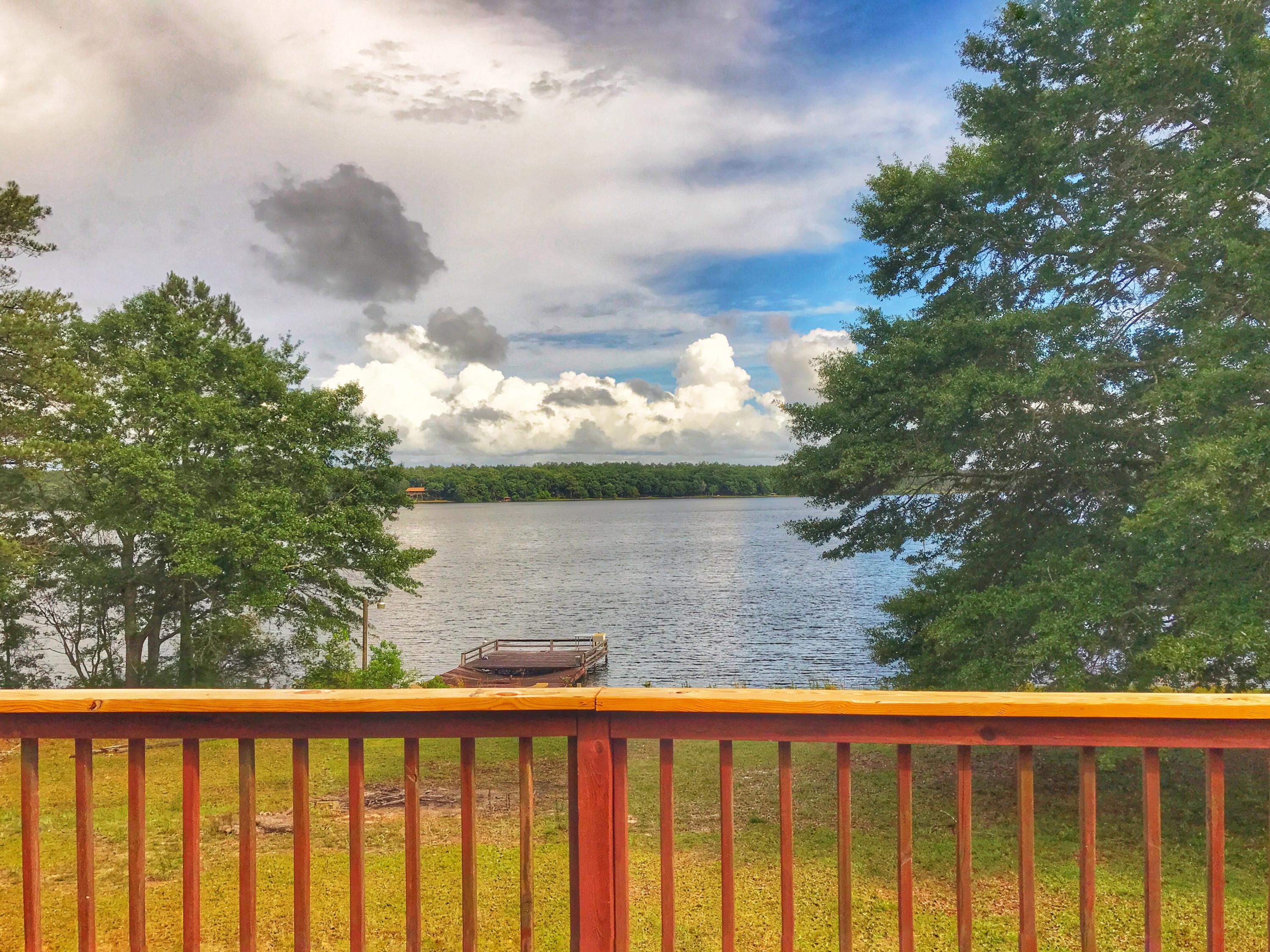 1326 Spring Lake Road DeFuniak Springs, FL 32433 - Photo 19 of 25 a view of a lake from a balcony