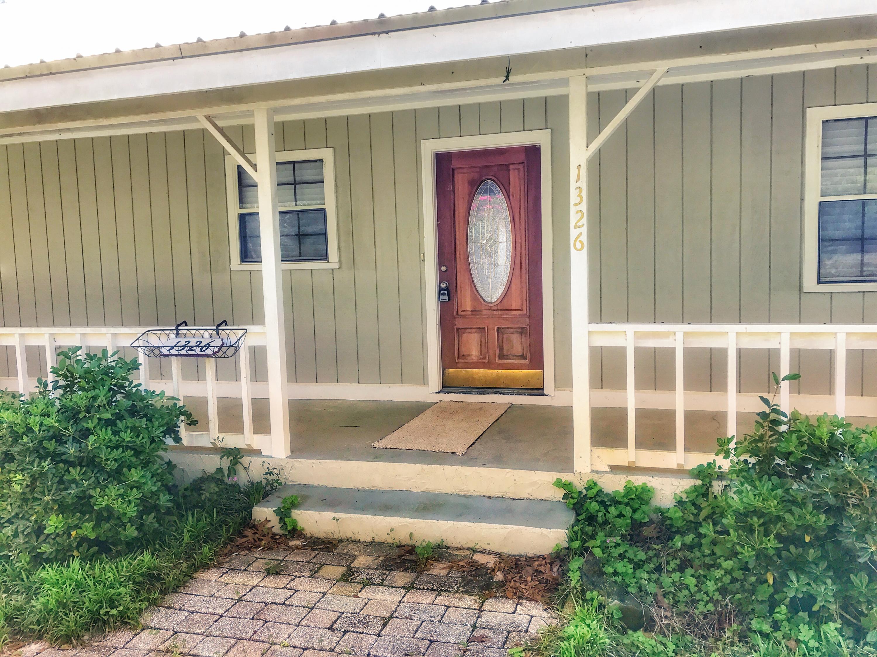 1326 Spring Lake Road DeFuniak Springs, FL 32433 - Photo 2 of 25 a front view of a house