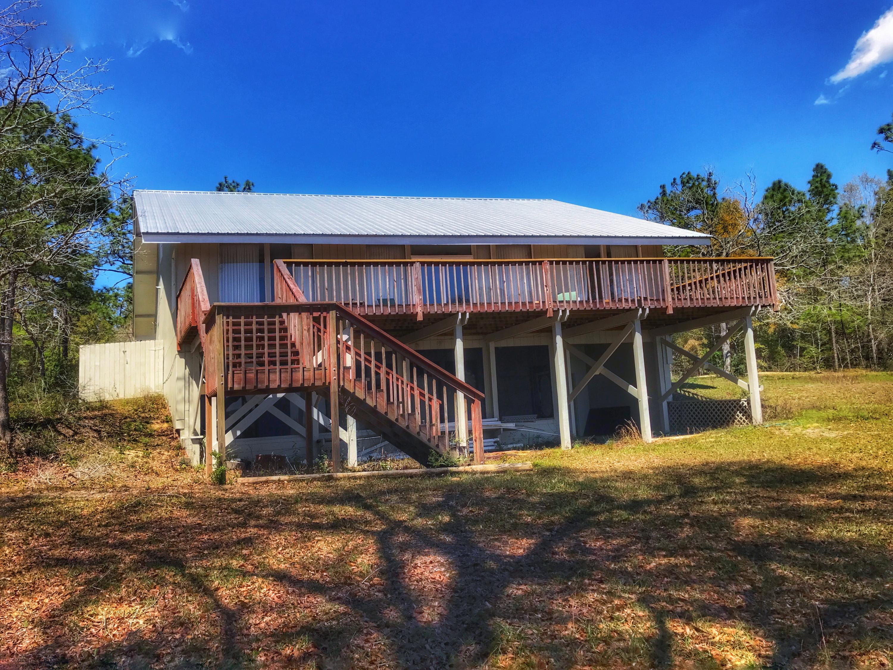 1326 Spring Lake Road DeFuniak Springs, FL 32433 - Photo 23 of 25 a view of a house with roof deck front of house