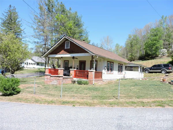 a front view of a house with swimming pool