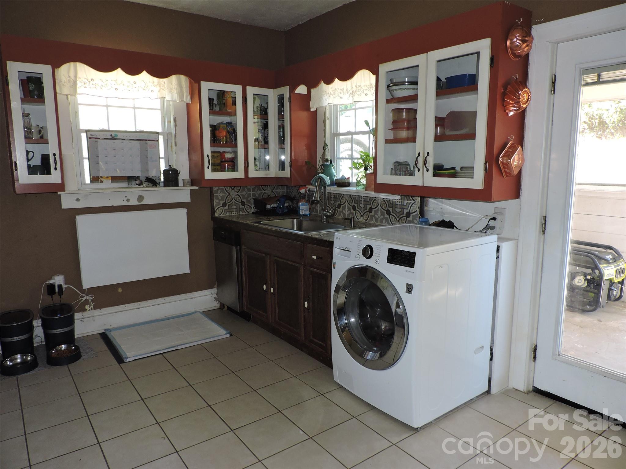 4 Carter Road Weaverville, NC 28787 - Photo 20 of 44 a utility room with cabinets dryer and washer