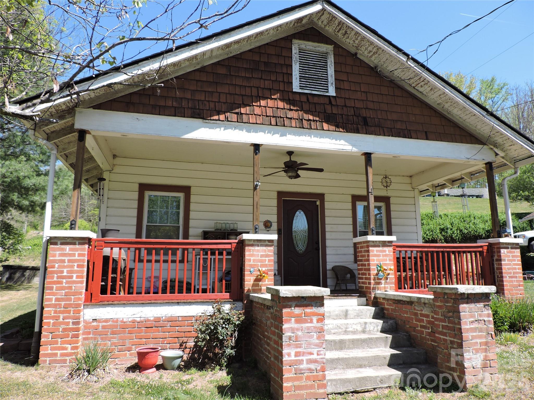 4 Carter Road Weaverville, NC 28787 - Photo 2 of 44 a view of a house with a small yard and wooden floor and fence
