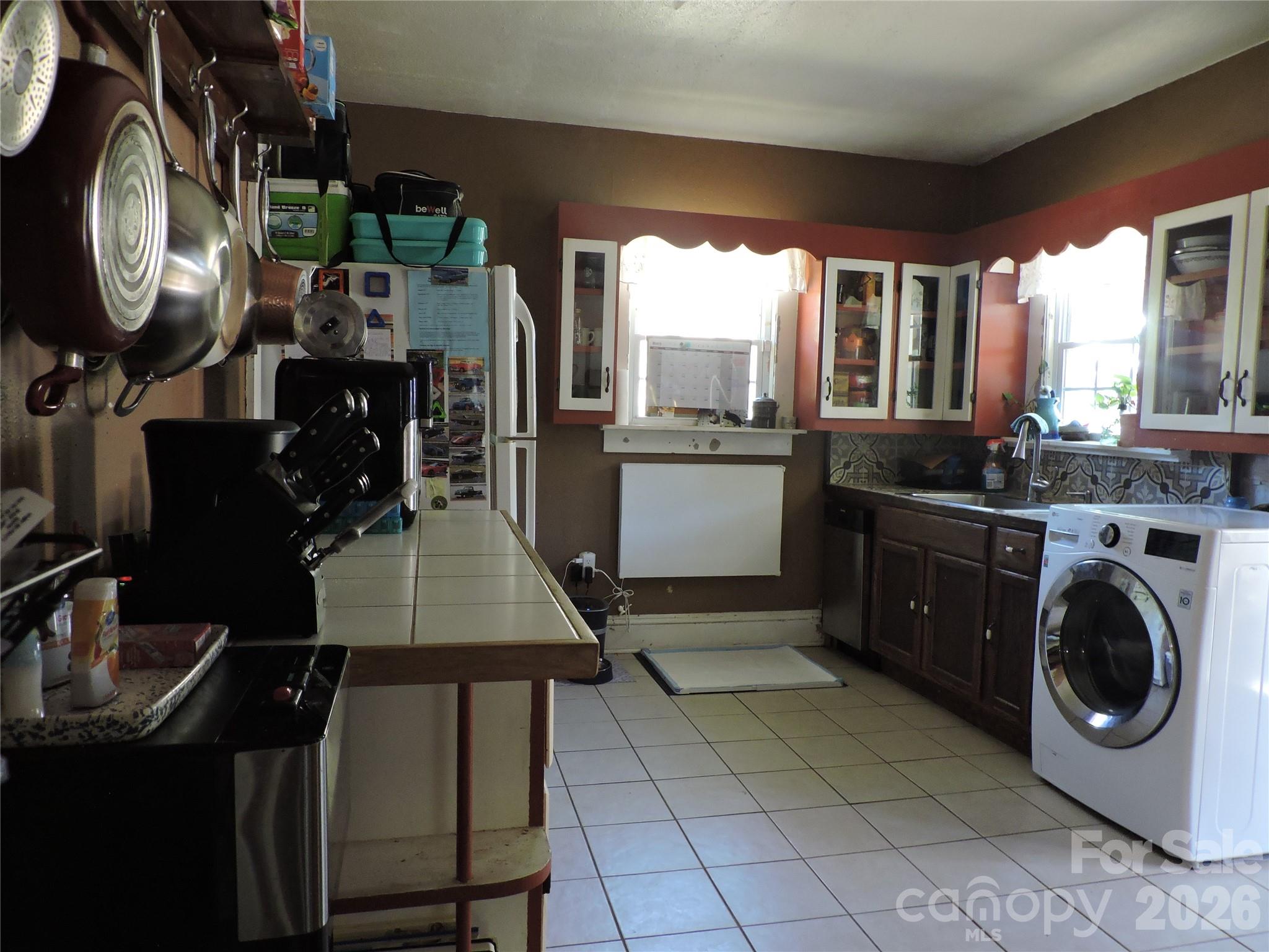 4 Carter Road Weaverville, NC 28787 - Photo 24 of 44 a kitchen with a sink a stove and cabinets