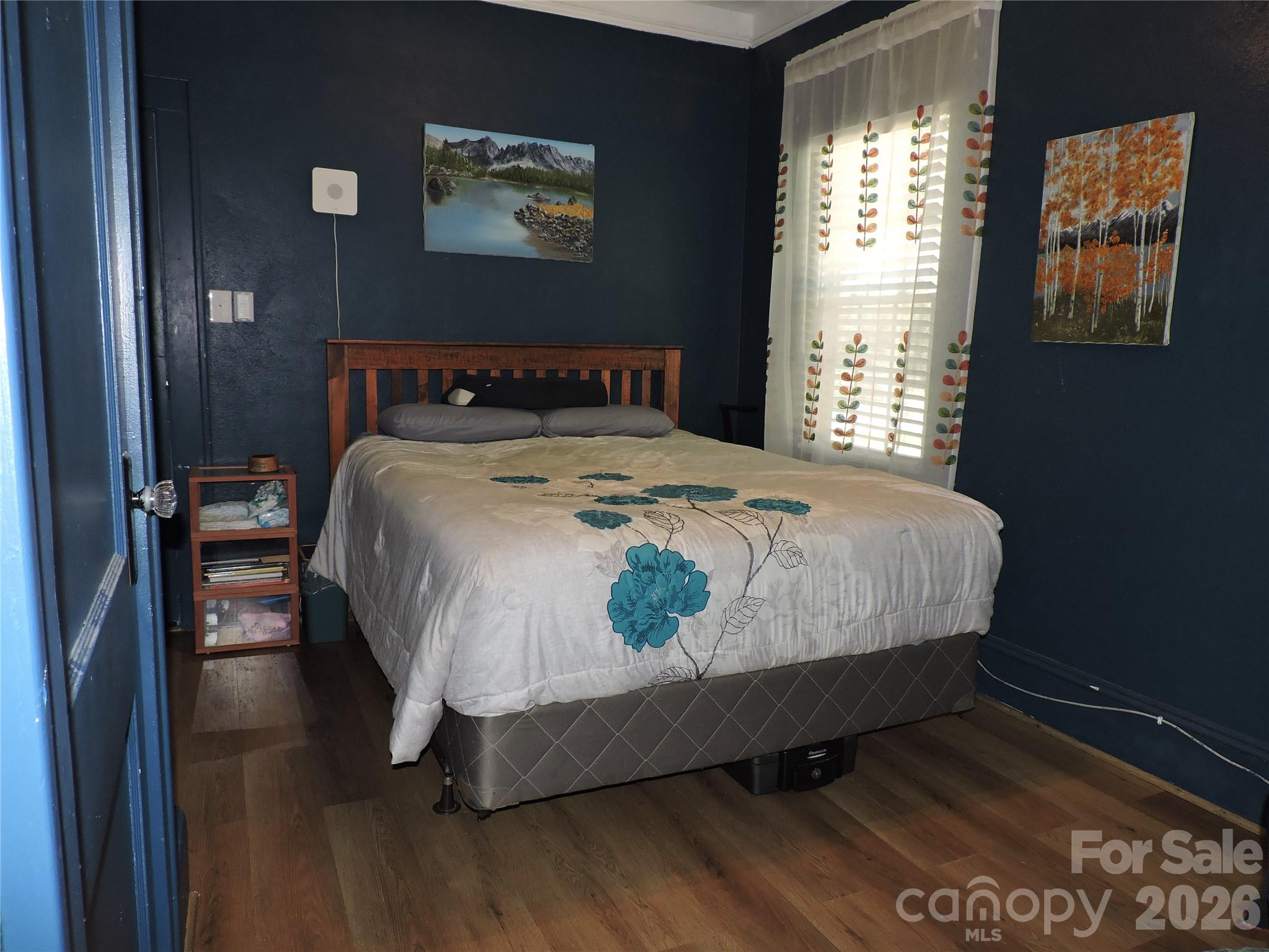 4 Carter Road Weaverville, NC 28787 - Photo 28 of 44 a bedroom with a bed and wooden floor