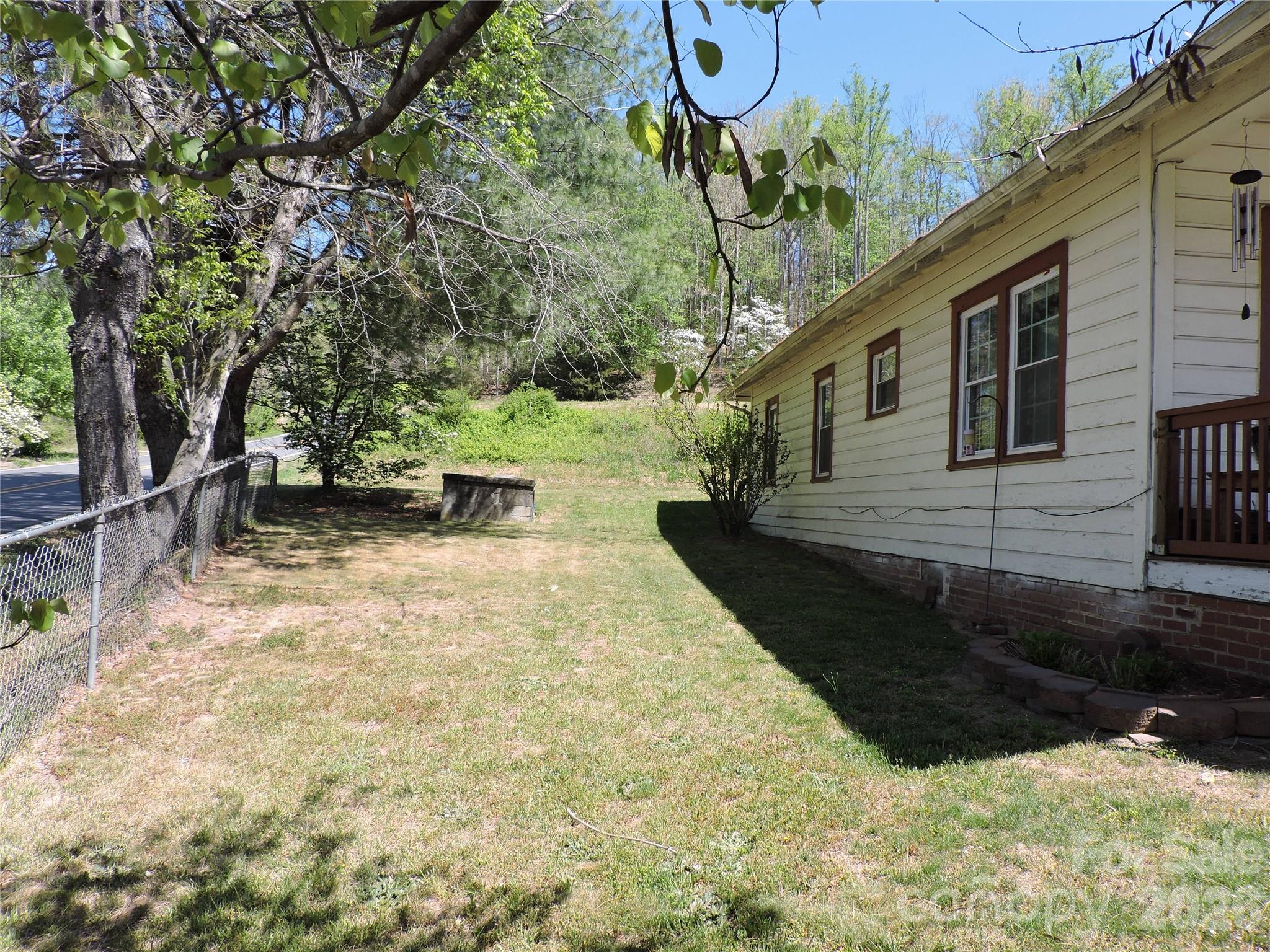 4 Carter Road Weaverville, NC 28787 - Photo 6 of 44 a view of a backyard with sitting area