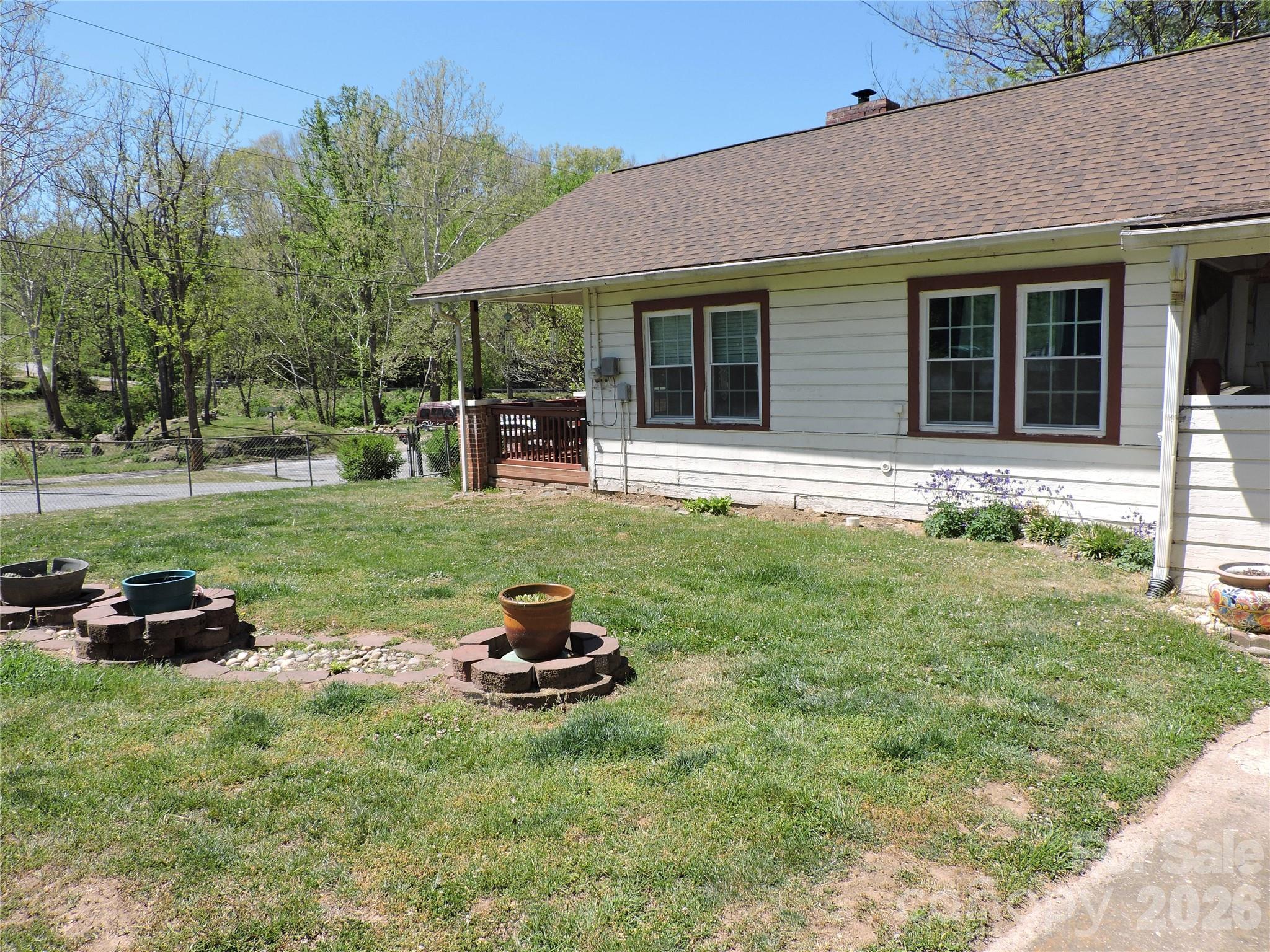 4 Carter Road Weaverville, NC 28787 - Photo 8 of 44 a view of a house with backyard sitting area and garden