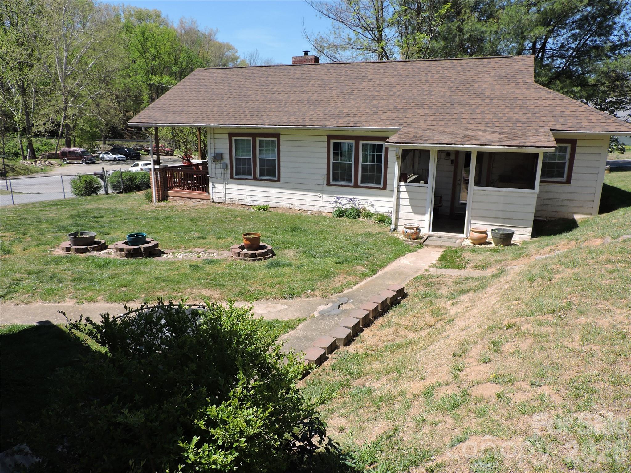 4 Carter Road Weaverville, NC 28787 - Photo 9 of 44 a front view of a house with a yard