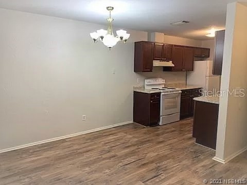 610 South Old County Road Edgewater, FL 32132 - Photo 4 of 10 a kitchen with cabinets and steel stainless steel appliances