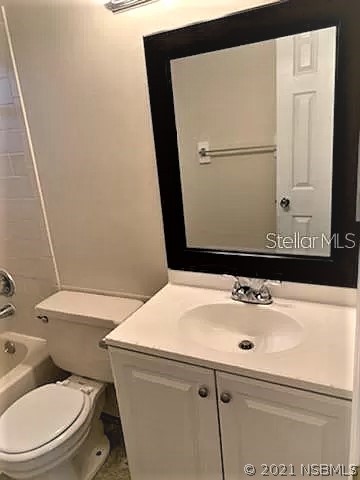 610 South Old County Road Edgewater, FL 32132 - Photo 7 of 10 a bathroom with a sink toilet and mirror