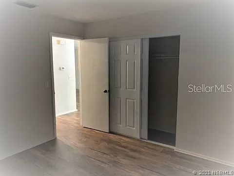 610 South Old County Road Edgewater, FL 32132 - Photo 10 of 10 an empty room with wooden floor and closet