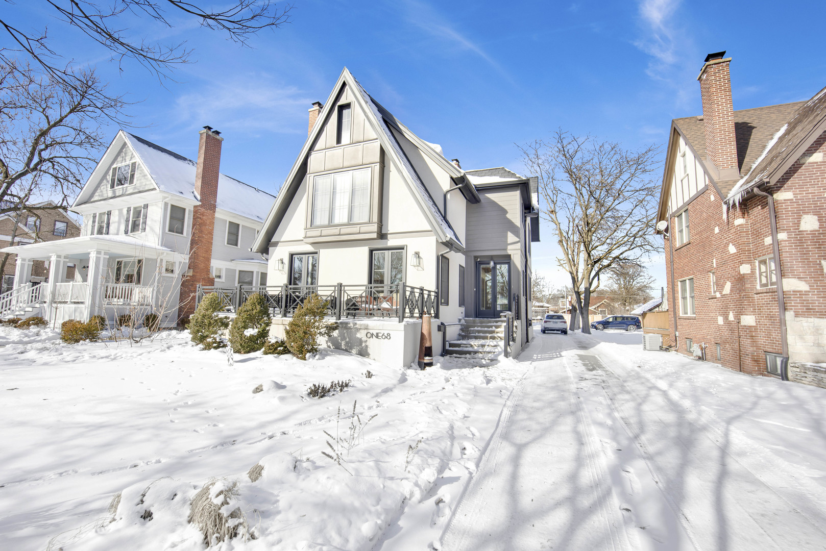 168 Lawton Road Riverside, IL 60546 - Photo 1 of 21 a view of a house with snow on the road