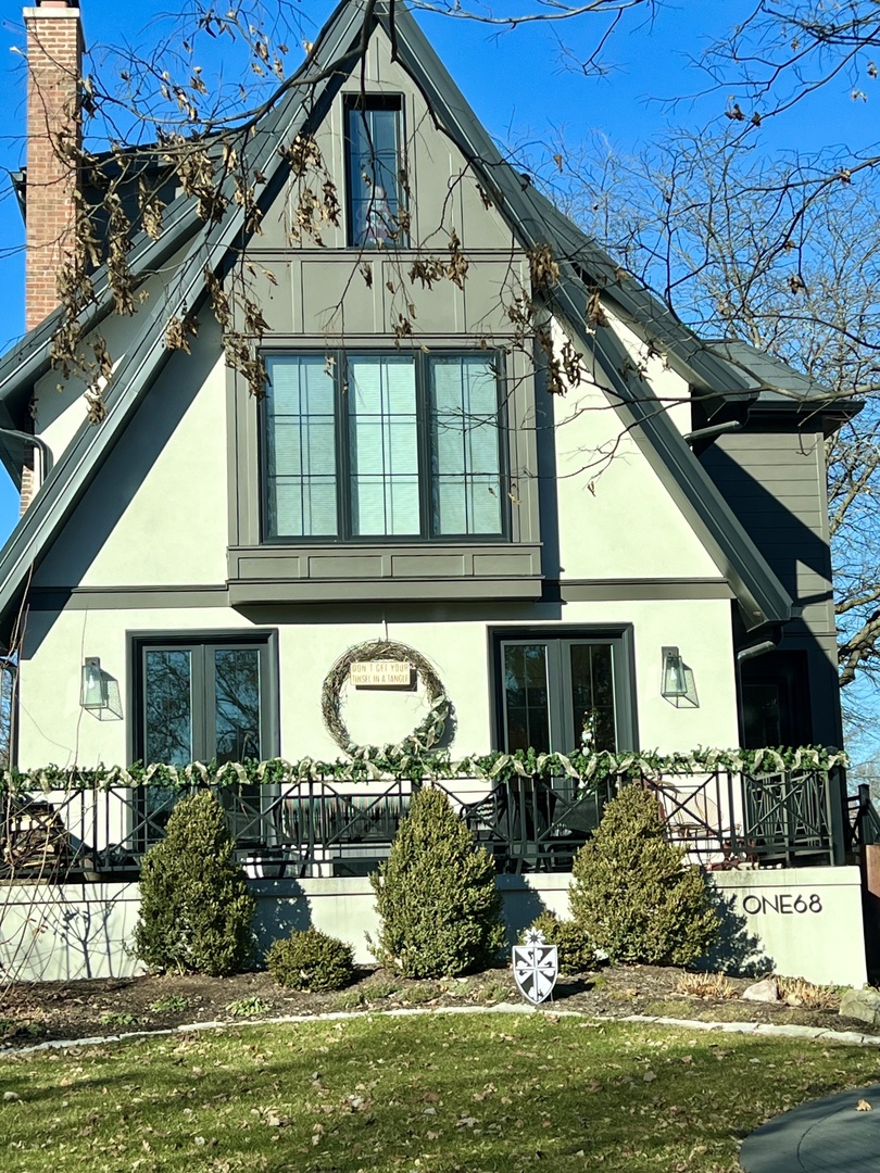 168 Lawton Road Riverside, IL 60546 - Photo 2 of 21 a front view of a house with garden