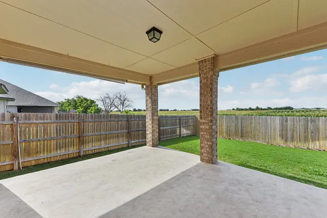 a view of a backyard with a lake view