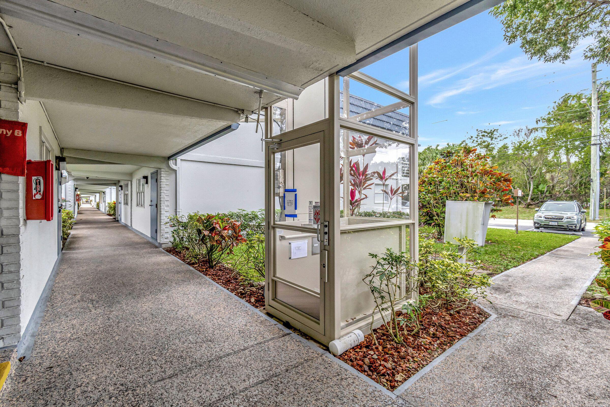 139 Tuscany Lane, Unit 139 Delray Beach, FL 33446 - Photo 11 of 21 a view of a pathway of a building