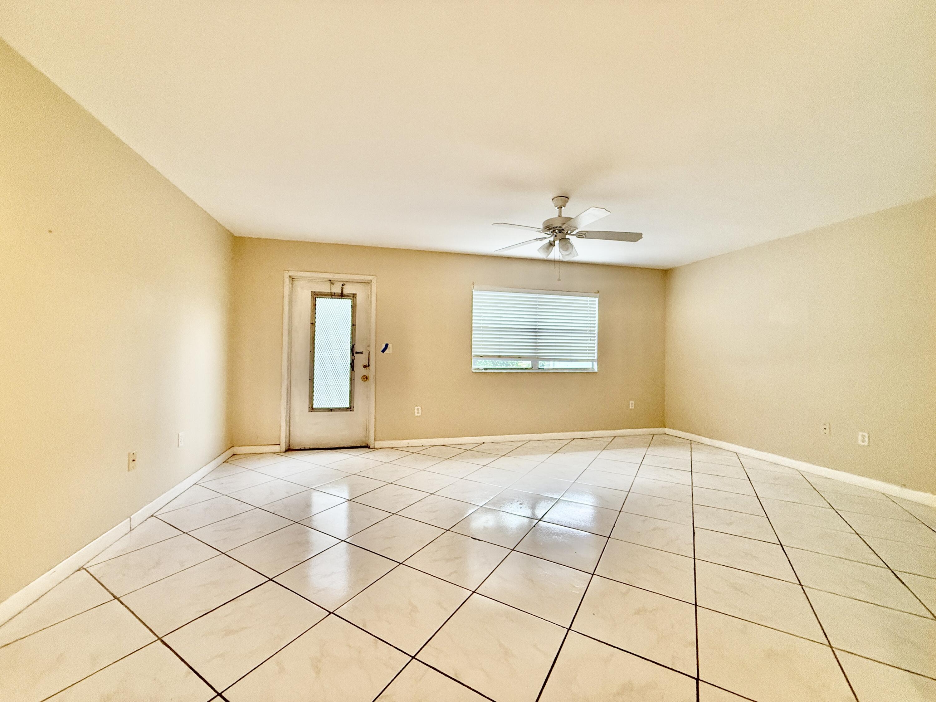 139 Tuscany Lane, Unit 139 Delray Beach, FL 33446 - Photo 2 of 21 a view of an empty room and window