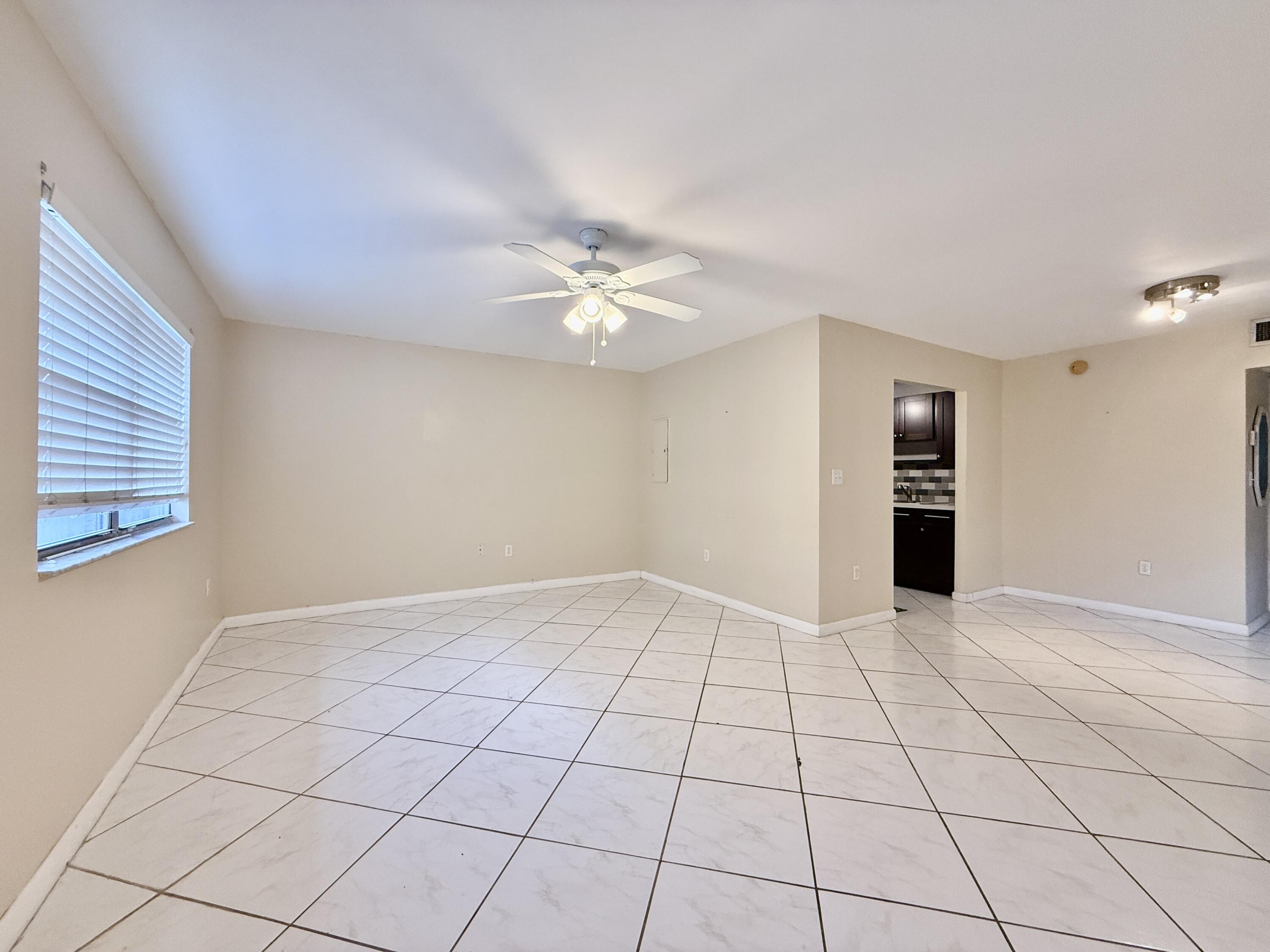 139 Tuscany Lane, Unit 139 Delray Beach, FL 33446 - Photo 5 of 21 a view of an empty room with a window