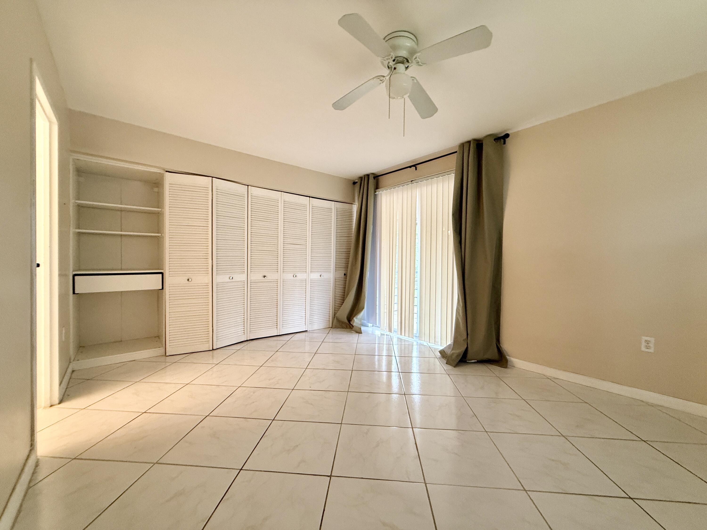 139 Tuscany Lane, Unit 139 Delray Beach, FL 33446 - Photo 7 of 21 a view of an empty room with a window