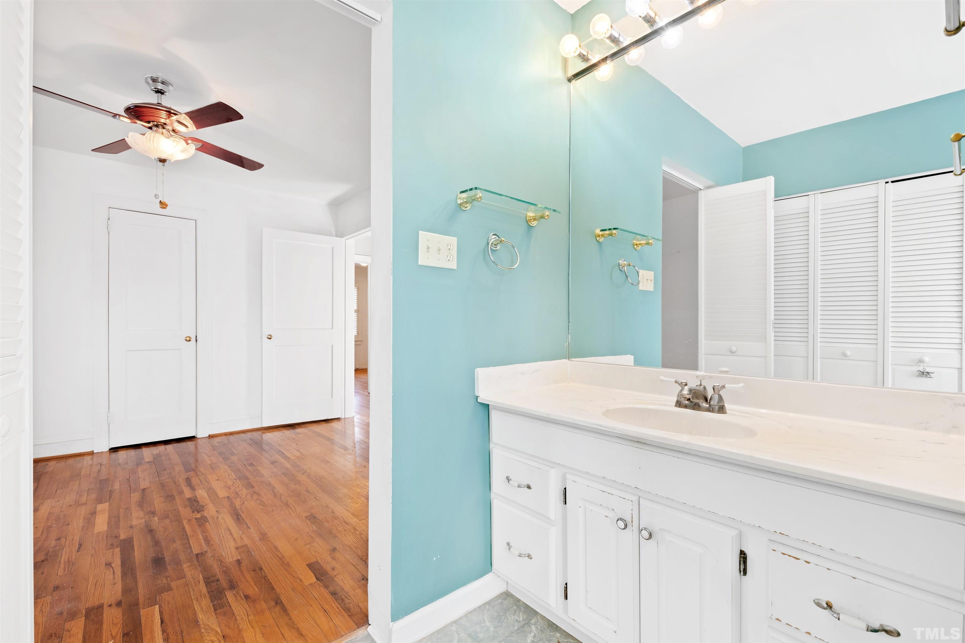 2713 Gordon Street Raleigh, NC 27608 - Photo 23 of 35 a bathroom with a sink and a mirror