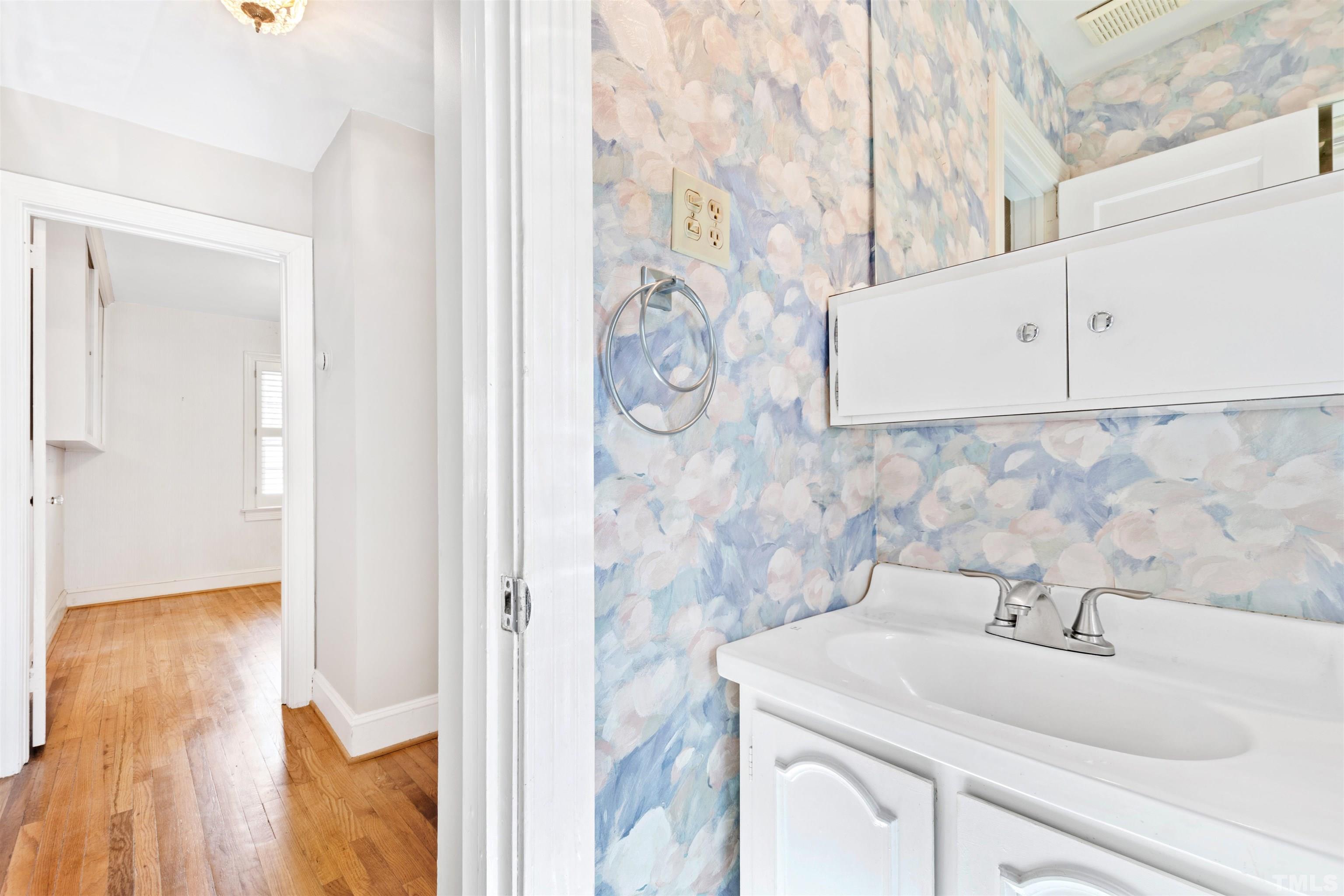2713 Gordon Street Raleigh, NC 27608 - Photo 28 of 35 a bathroom with a sink and vanity