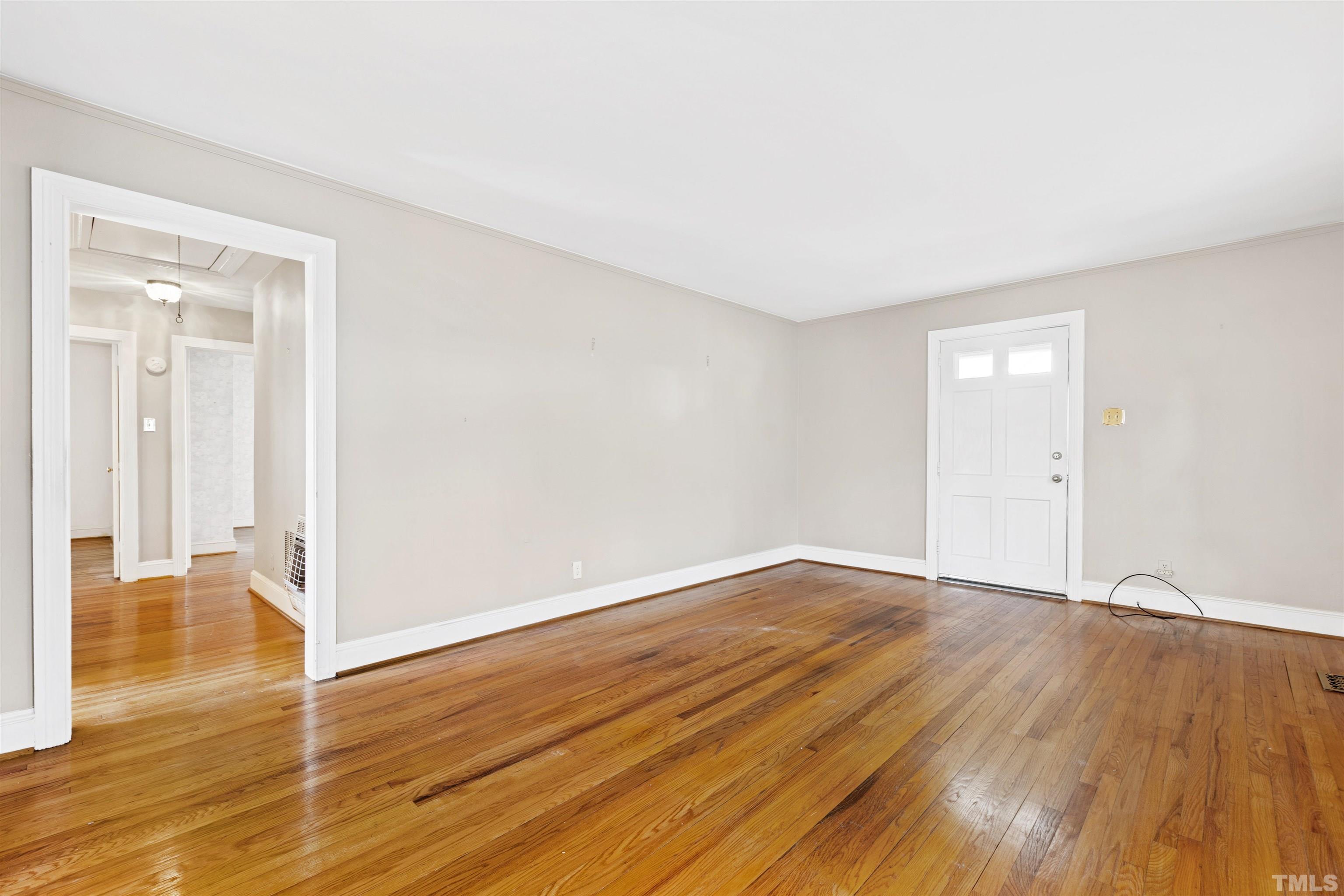2713 Gordon Street Raleigh, NC 27608 - Photo 6 of 35 a view of an empty room with wooden floor