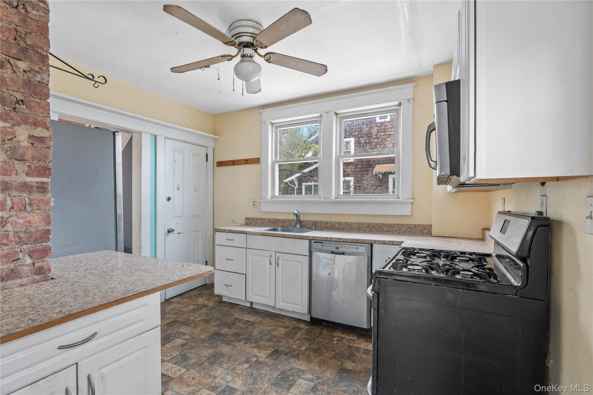 21 Stephens Lane Tappan, NY 10983 - Photo 15 of 30 a kitchen with stainless steel appliances granite countertop a stove a sink and a refrigerator