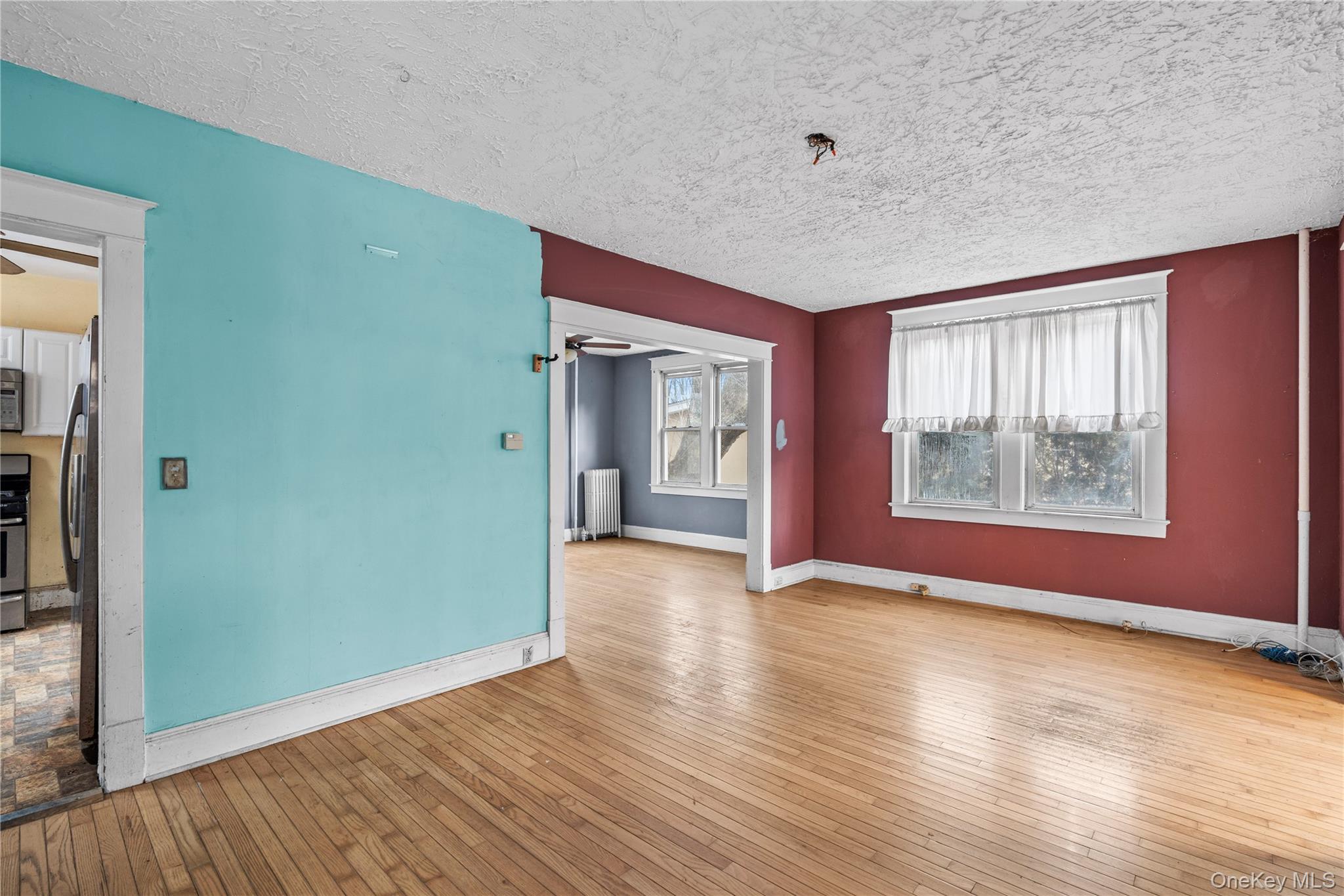21 Stephens Lane Tappan, NY 10983 - Photo 8 of 30 an empty room with wooden floor and windows