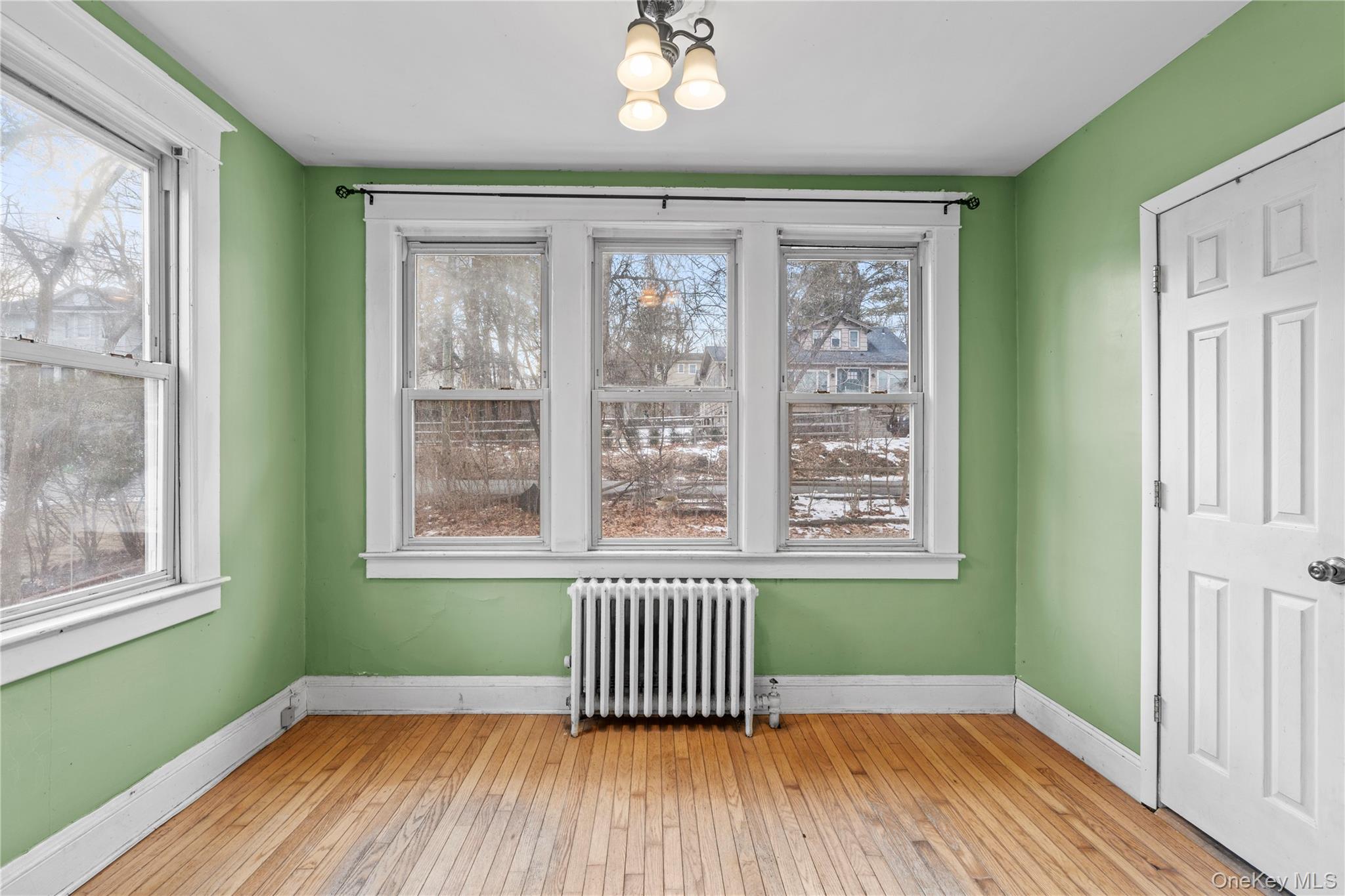 21 Stephens Lane Tappan, NY 10983 - Photo 9 of 30 a view of empty room with wooden floor and fan
