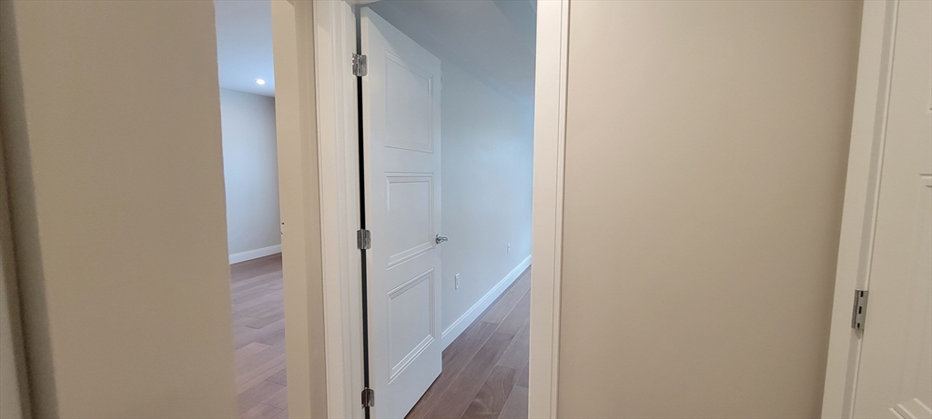 425 Lagrange Street, Unit 206 Boston, MA 02132 - Photo 14 of 15 a view of a hallway