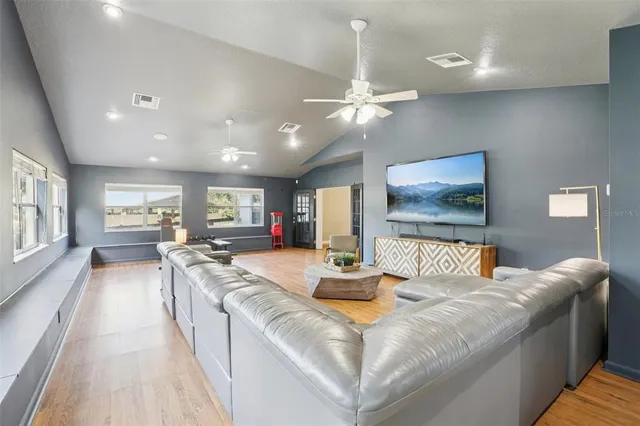 a kitchen with a refrigerator stove and white cabinets