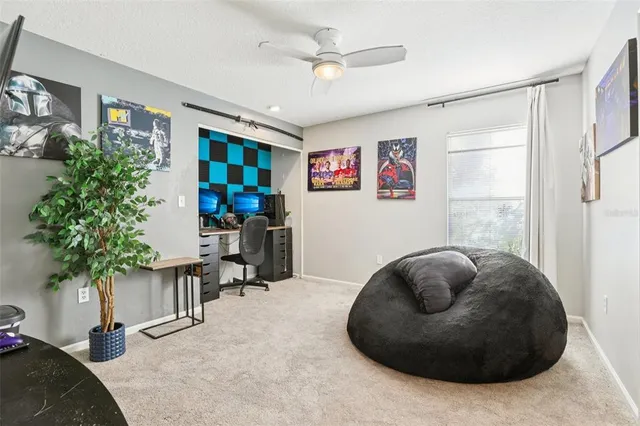 a view of a park with swimming pool and sitting area