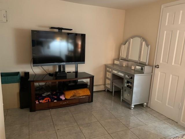 73 Bartlett Place Brooklyn, NY 11229 - Photo 11 of 14 a living room with furniture and a flat screen tv