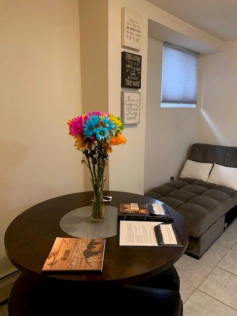 73 Bartlett Place Brooklyn, NY 11229 - Photo 14 of 14 a vase of flowers sitting on a table