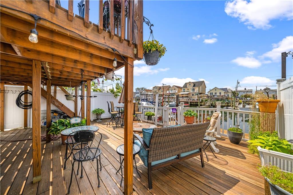 73 Bartlett Place Brooklyn, NY 11229 - Photo 3 of 14 a roof deck with table and chairs