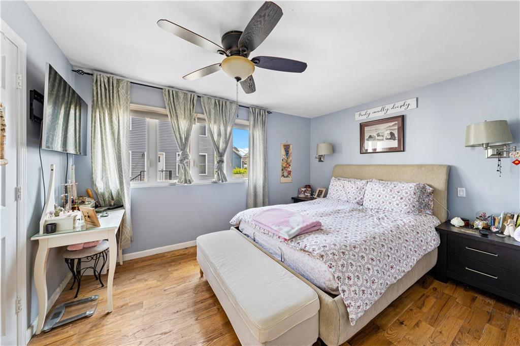 73 Bartlett Place Brooklyn, NY 11229 - Photo 7 of 14 a bedroom with a bed and dresser with mirror