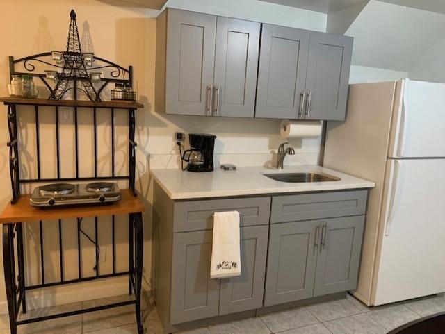 73 Bartlett Place Brooklyn, NY 11229 - Photo 10 of 14 a kitchen with stainless steel appliances granite countertop a stove a refrigerator and cabinets