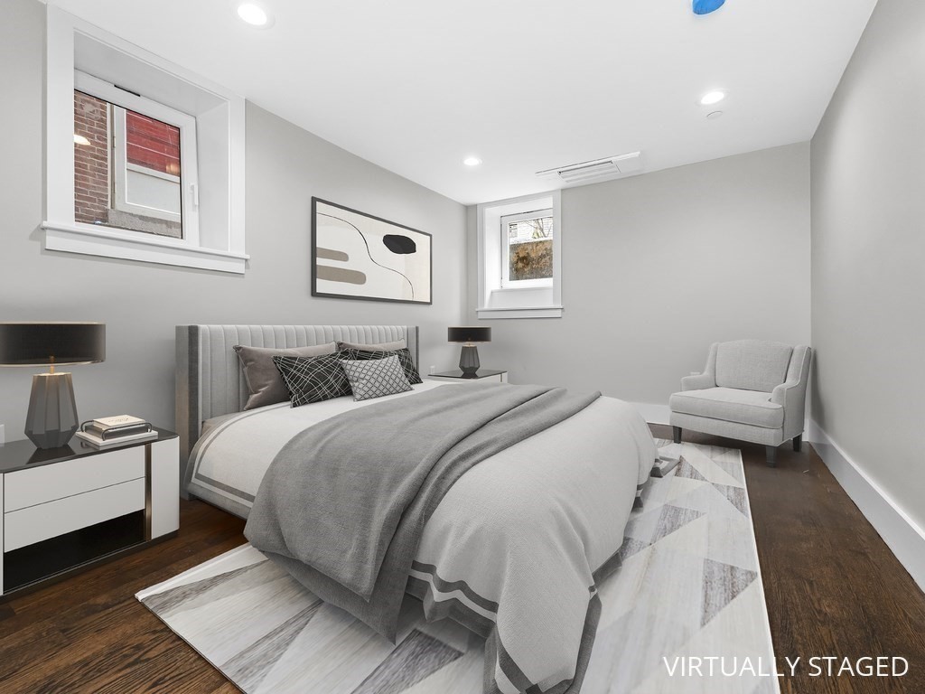 9 Monument Square, Unit 1 Boston, MA 02129 - Photo 10 of 15 a bedroom with a bed and a couch