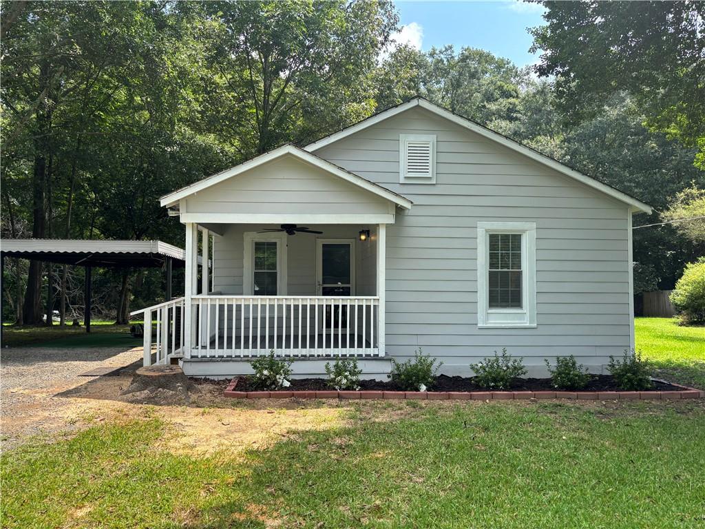 3855 Oglesby Road Powder Springs, GA 30127 - Photo 1 of 1 a front view of a house with garden