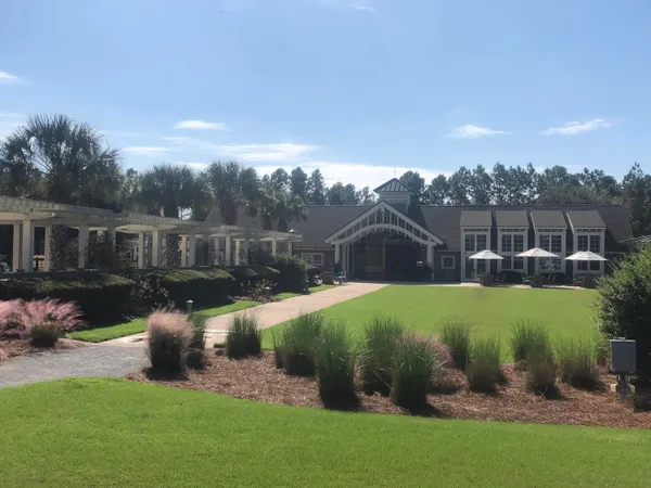 a view of a garden with a house