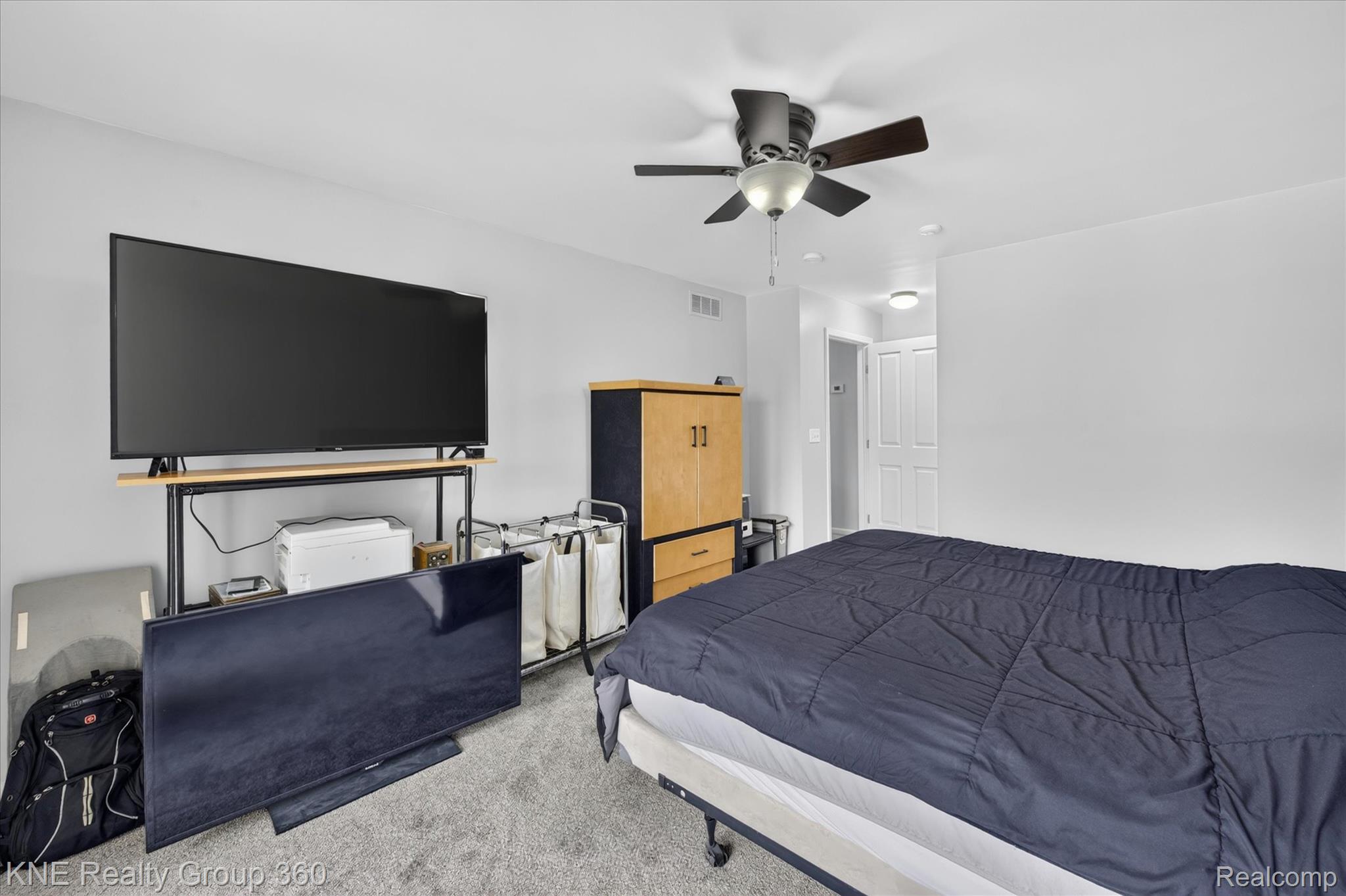 4077 Berkeley Avenue Canton, MI 48188 - Photo 19 of 32 Wall-to-wall carpeting and a ceiling fan with integrated lighting