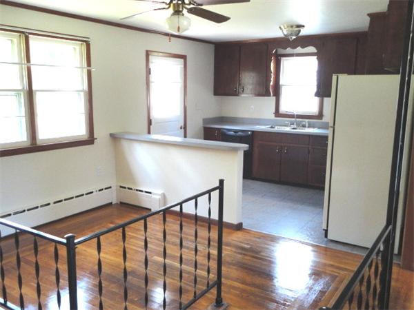 744 Wheelwright Road Barre, MA 01005 - Photo 4 of 10 a kitchen with stainless steel appliances granite countertop a refrigerator a sink dishwasher a stove and white countertops with wooden floor
