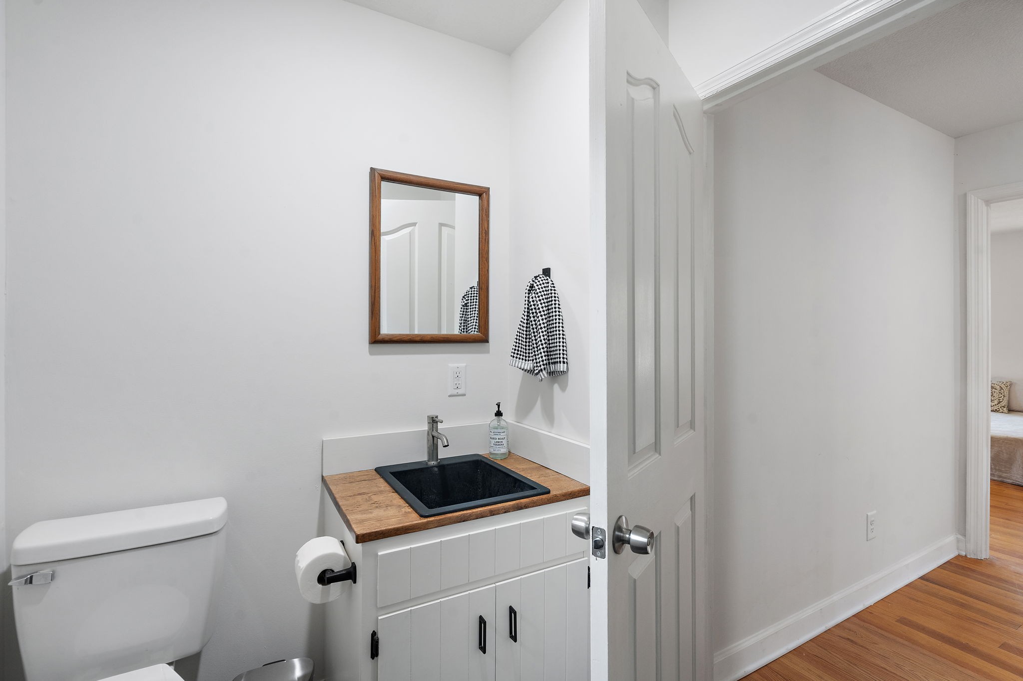 131 Locker Road Summertown, TN 38483 - Photo 14 of 38 a bathroom with a toilet sink and mirror