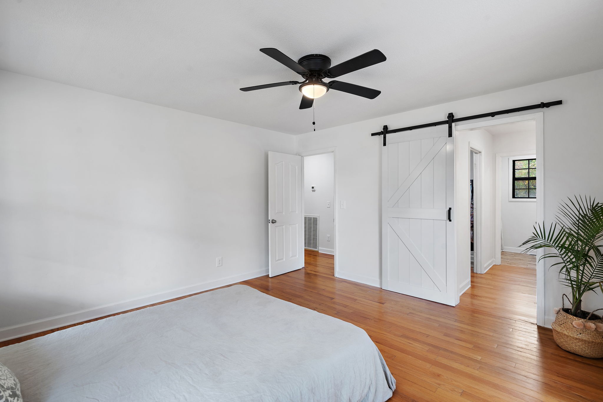 131 Locker Road Summertown, TN 38483 - Photo 17 of 38 a bedroom with a bed and a ceiling fan