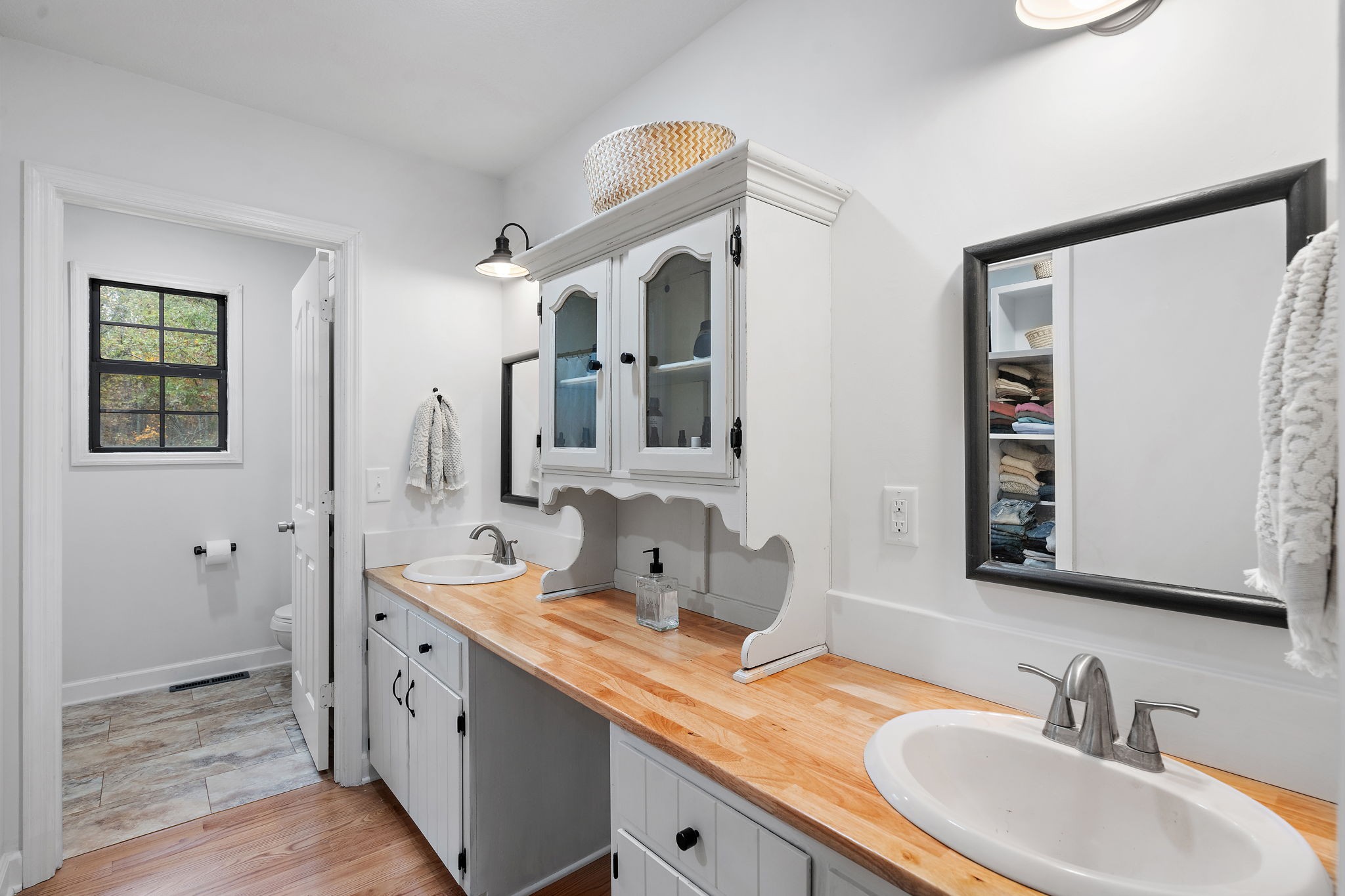 131 Locker Road Summertown, TN 38483 - Photo 18 of 38 a bathroom with double vanity sinks and a mirror