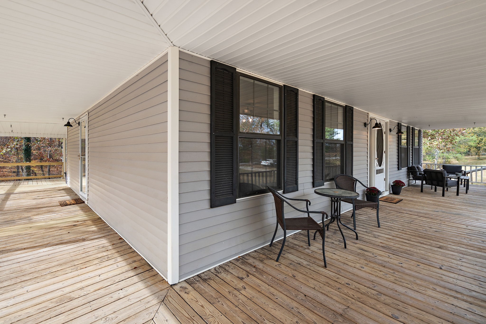 131 Locker Road Summertown, TN 38483 - Photo 3 of 38 a balcony with chairs and wooden floor